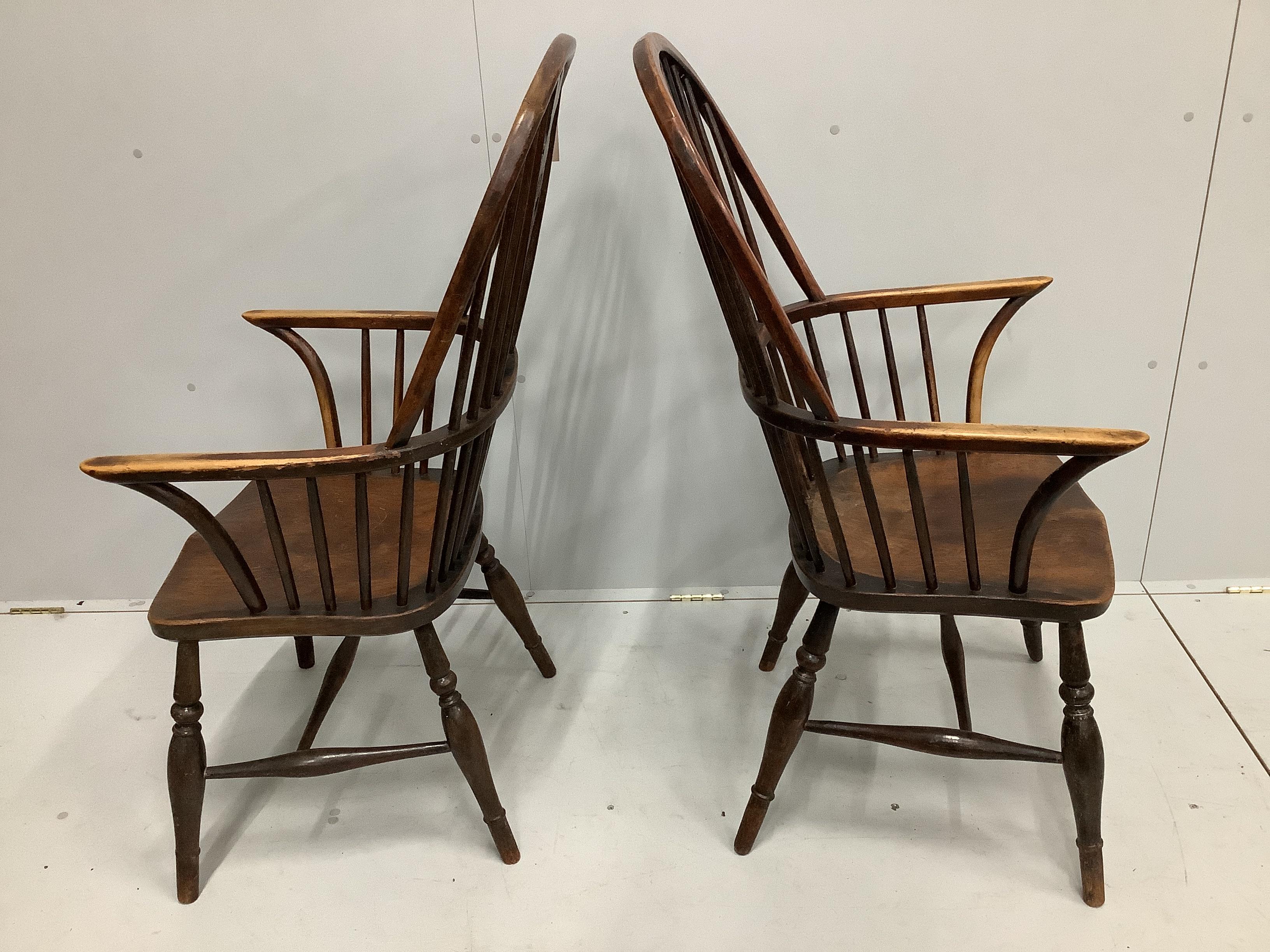 A pair of 19th century Thames Valley elm and beech Windsor wheelback armchairs, width 59cm, depth 43cm, height 114cm